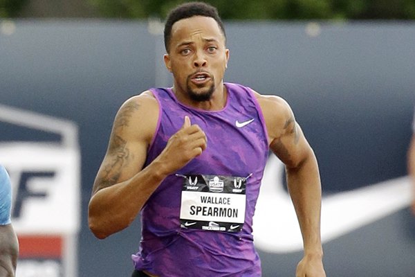 In this June 28, 2015, photo, Wallace Spearmon sprints for the finish line during the 200 meters semifinals at the U.S. Track and Field Championships in Eugene, Ore. For 30 memorable minutes, Spearmon earned a bronze medal at the 2008 Beijing Olympics--and then it was taken away when he was disqualified for stepping outside his lane. (AP Photo/Don Ryan)