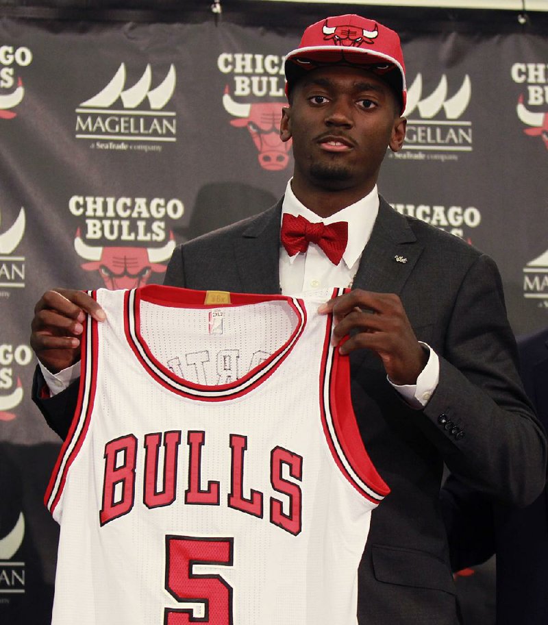 The Chicago Bulls' first round draft pick, Bobby Portis, from the University of Arkansas, holds his Bulls jersey after being introduced as the Bullsí top pick during an NBA basketball news conference Monday, June 29, 2015, in Chicago.