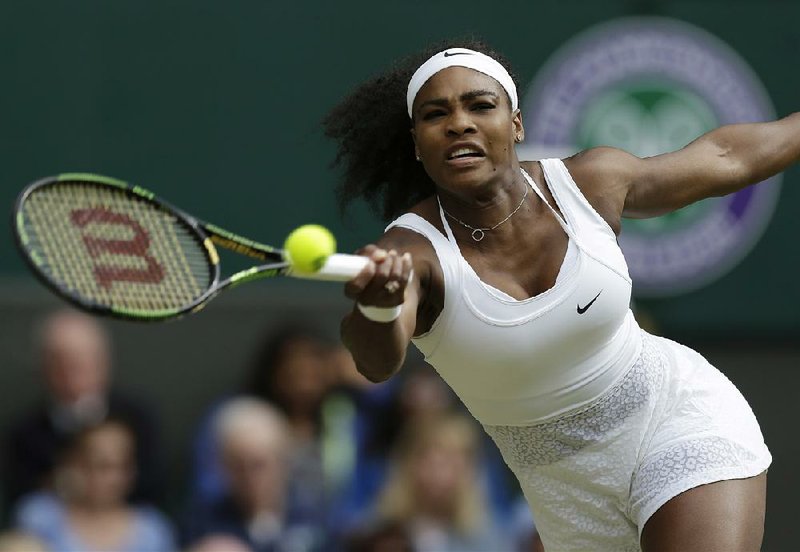 Top-seeded Serena Williams returns a shot in her three-set victory over Victoria Azarenka on Tuesday in a quarterfinal match at Wimbledon. Williams had 17 aces.