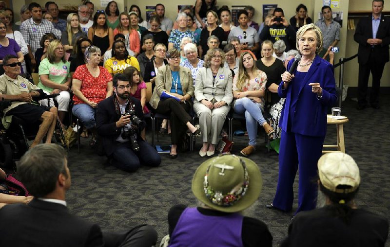 Hillary Rodham Clinton campaigns Tuesday in Iowa, including this stop at the Iowa City Public Library. 