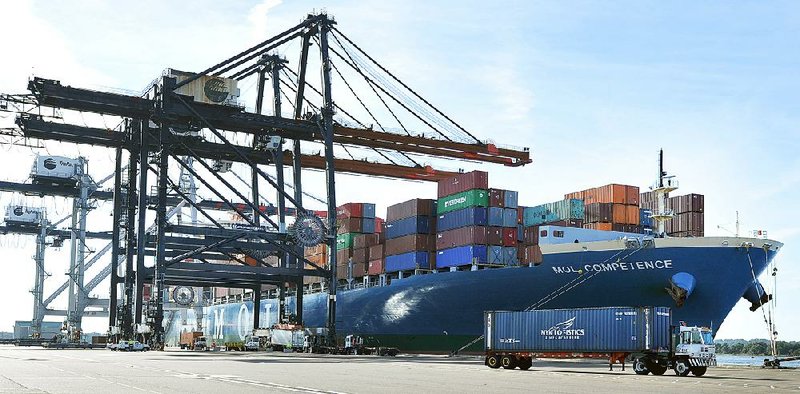 The MOL Competence, a 1,036-foot-long container ship carrying 45,000 tons of cargo, is moored in this file photo at the TraPac Container Terminal in Jacksonville, Fla. The Commerce Department said Tuesday that the nation’s trade deficit increased 2.9 percent to $41.9 billion in May.