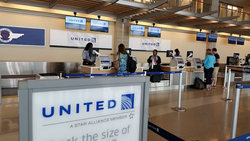 Passengers check in at the United Airlines counter at the Bill and Hillary Clinton National Airport in Little Rock on Wednesday, July 8, 2015. 