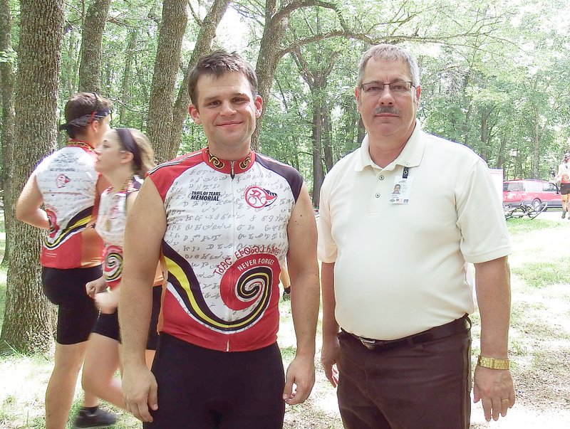 TIMES photographs by Annette Beard Pea Ridge Mayor Jackie Crabtree visited with Cherokee bike rider Billy Flint when the group stopped at Pea Ridge National Military Park for lunch provided by the Pea Ridge National Military Park Foundation and Catfish John&#8217;s.