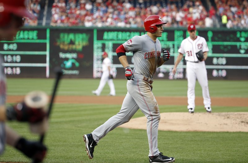 Cincinnati Reds' Joey Votto runs the bases on a solo home run as Washington Nationals starting pitcher Max Scherzer (31) stands on the mound during the third inning of a baseball game at Nationals Park, Tuesday, July 7, 2015, in Washington.