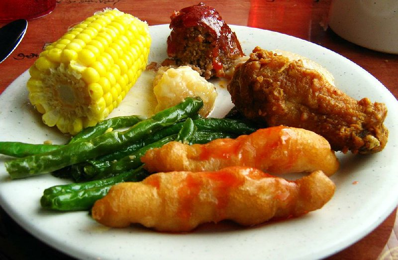 Sweet and sour chicken, meatloaf, coconut shrimp, fried chicken wings, corn on the cob and green beans are among the buffet items at Kirin Garden in North Little Rock. 