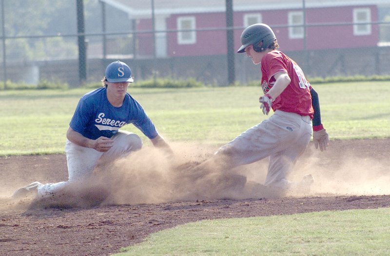 RICK PECK/SPECIAL TO MCDONALD COUNTY PRESS McDonald County&#8217;s Dagan Stites gets tagged out at second base while trying to steal during McDonald County&#8217;s 11-0 win June 29 at McDonald County High School.