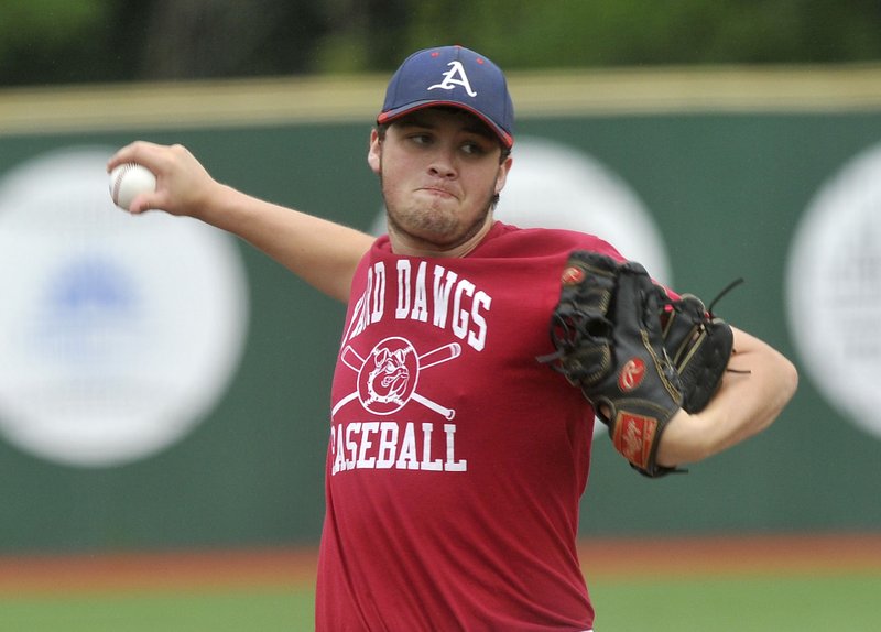 Arkansas Yard Dogs pitcher Preston Rosales pitches Thursday against the Midwest Nationals in Fayetteville.