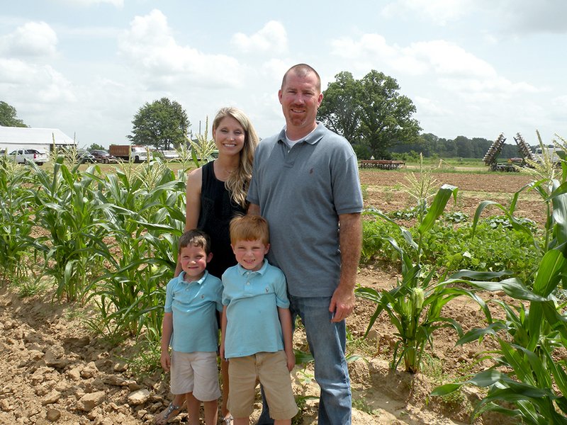 The John R. Hamilton family of Searcy is the East Central District Farm Family of the Year for 2015, as well as the White County Farm Family of the Year. The Hamiltons raise rice, soybeans, wheat and corn, along with a vegetable garden, on their farm in the West Point community. John and his wife, Mikki, are shown here in their vegetable garden with their sons, Jim, 4, left, and John David, 6.