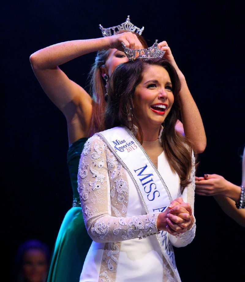 Loren McDaniel of Van Buren is crowned the new Miss Arkansas by her predecessor Ashton Campbell at the 2015 pageant Saturday night in Hot Springs.