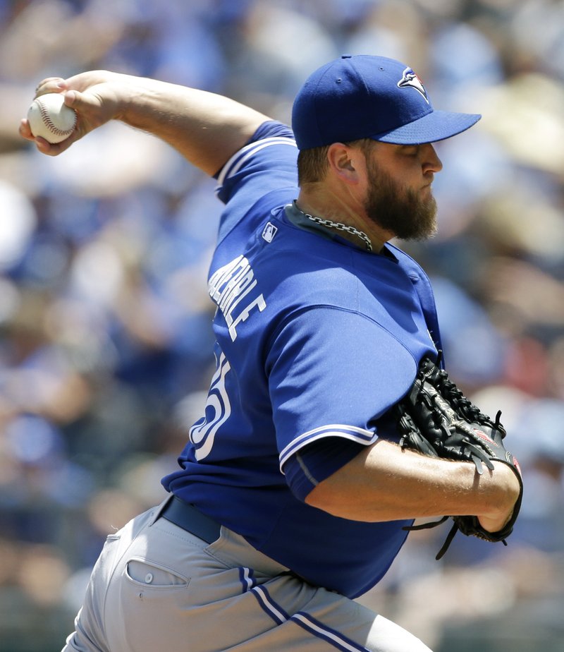 Toronto Blue Jays starting pitcher Mark Buehrle delivers to a Kansas City Royals batter during the second inning of a baseball game at Kauffman Stadium in Kansas City, Mo., Saturday, July 11, 2015. 