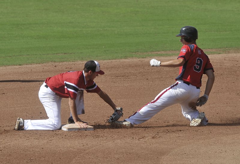 Blake Wynn, Rawlings Prospects short stop, tags out Mac-N-Seitz Indians baserunner Aaron Meers as he tries to steal second base during Saturday’s game at Baum Stadium in Fayetteville