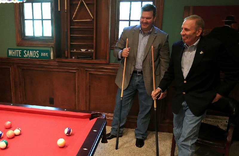 Dr. Marvin Leibovich (right) and Arkansas State Police Lt. Rick Neill play pool at Leibovich’s home in Saline County on Friday. Leibovich, 68, has officially retired from his position as tactical physician with Little Rock police and Arkansas State Police. Since 1992, he has been accompanying the agencies’ tactical teams on raids, tending to the injuries of officers and criminal suspects.