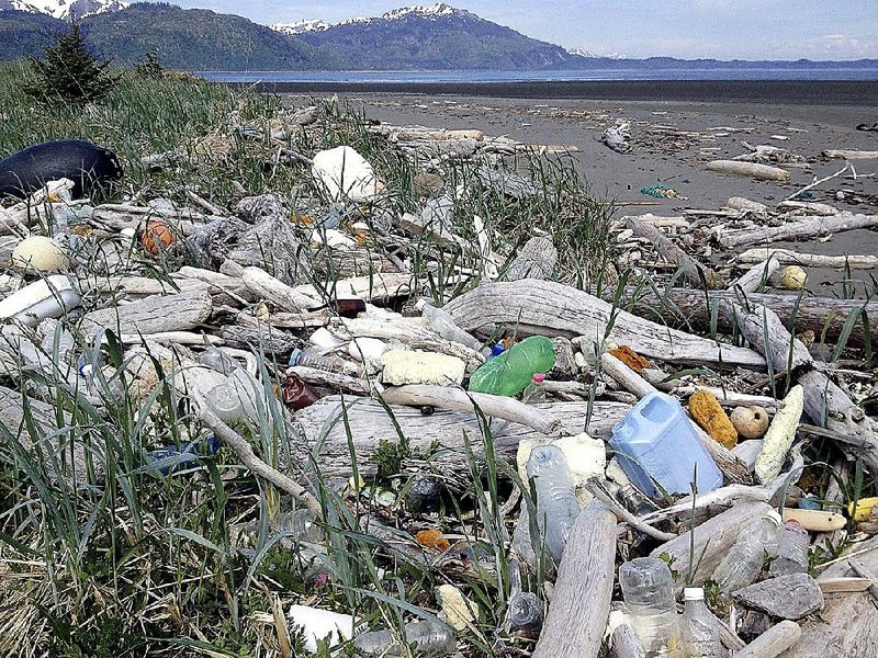 Debris litters the shore on Montague Island, Alaska, in this undated photo provided by the Alaska Department of Environmental Conservation. Tons of marine debris, some likely sent to sea by the 2011 tsunami in Japan, are set to be airlifted from rocky beaches and taken by barge for recycling and disposal in the Pacific Northwest.