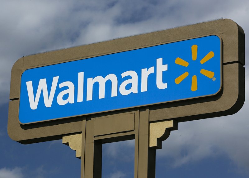 FILE - This May 28, 2013 file photo shows a sign outside a Wal-mart store in Duarte, Calif. 