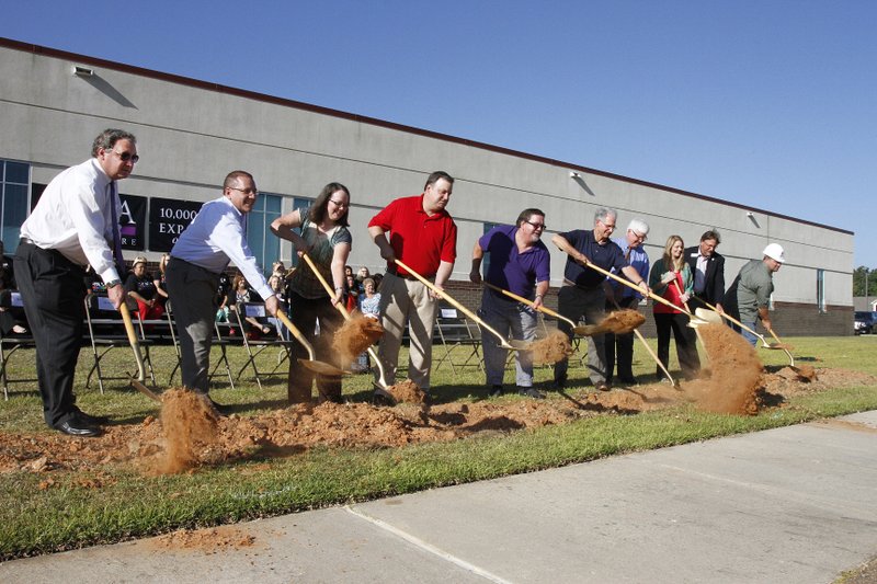 SAMA: The groundbreaking ceremony for the expansion of the SAMA (South Arkansas Medical Associates) clinic. Left to right: Jeremy Stratton, President and CEO of the El Dorado Chamber of Commerce; SAMA Administrator Pete Atkinson; Deanna Hopson, M.D.; Eric Hatley, M.D.; Matt Callaway, M.D.; Jim Sheppard, M.D.; Gary Bevill, M.D.; Lauren Monteith, M.D.; Scott Fite of Southern Bancorp and David Foote of Shields Construction.
