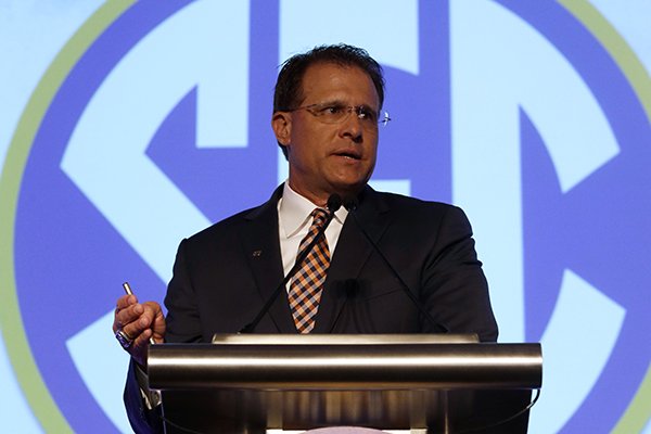 Auburn coach Gus Malzahn speaks to the media during the NCAA college football Southeastern Conference Media Days, Monday, July 13, 2015, in Hoover, Ala. (AP Photo/Butch Dill)