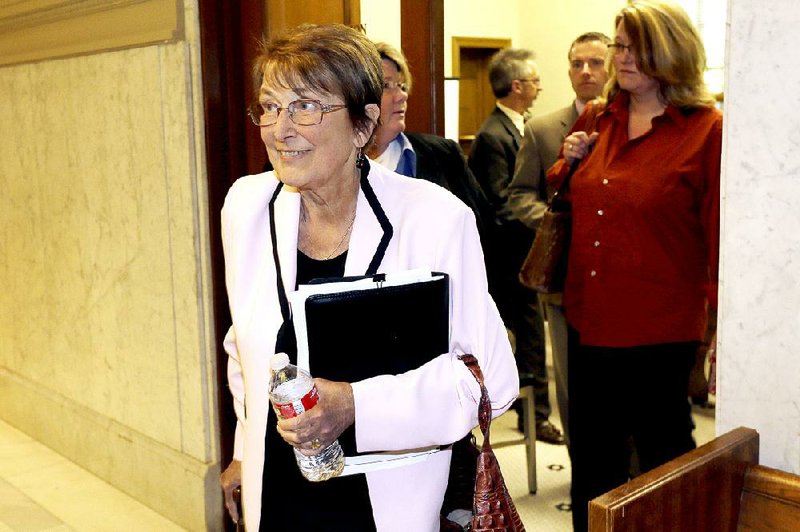 Attorney Cheryl Maples leaves a courtroom in the Pulaski County Court House in Little Rock in this April 2014 file photo.