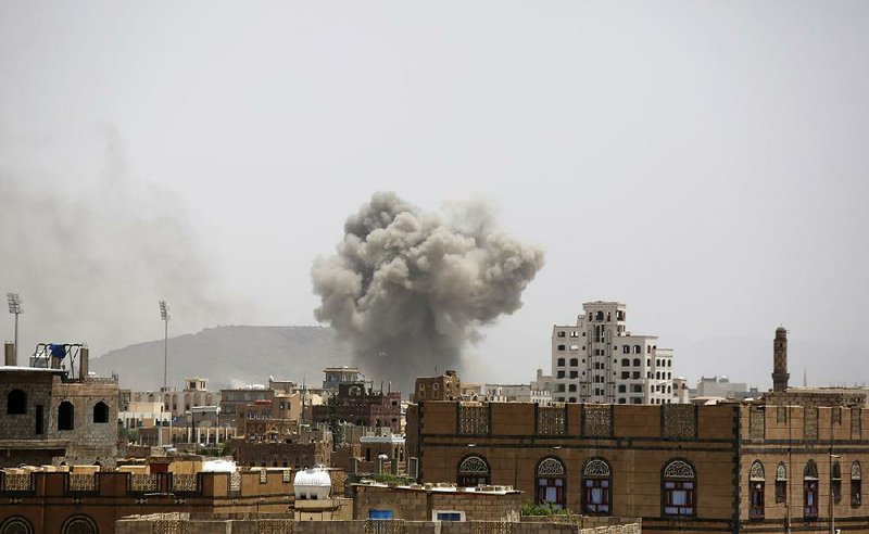 Smoke rises after an airstrike by the Saudi-led coalition Tuesday in Sanaa, Yemen. 