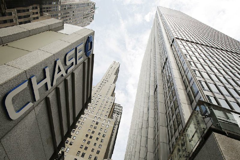 This photo shows a Chase Bank office tower in New York’s financial center Monday. JPMorgan Chase & Co. said Tuesday that it earned $5.78 billion in the second quarter. 