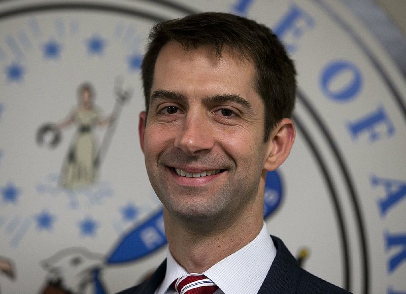 Sen. Tom Cotton, R-Ark. arrives to pose for photographers in his office on Capitol Hill in Washington in this Wednesday, March 11, 2015 file photo.   