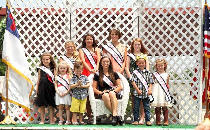 Photographs by Russ Wilson Miss Pea Ridge Rebecca Woods (center) is surrounded by her court Saturday after all were selected during pageants Friday and Saturday. Pageant winners include Jr. Miss Pea Ridge Makenzie Trimble, Miss Teen Kelsey Willett, Miss Pre-Teen Macie Foltz, Princess Kayleigh Mathis, Little Miss Kairi McInturff, Miss Tiny Tot Avary Keene, Mr. Tiny Tot Tristin Fletcher, Miss Teeny Tot Macy Dyson and Mr. Teeny Tot Rayce McBurnett.