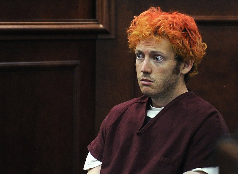 In this July 23, 2012, file photo, James Holmes, who is charged with killing 12 moviegoers and wounding 70 more in a shooting rampage in a crowded theater in Aurora, Colo., in July 2012, sits in Arapahoe County District Court in Centennial, Colo. 