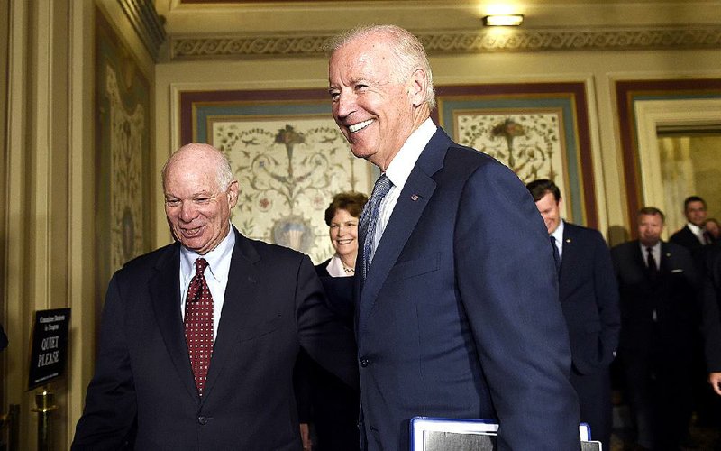 Vice President Joe Biden walks Thursday with Senate Foreign Relations Committee members Sen. Ben Cardin, D-Md. (left), and Sen. Jeanne Shaheen, D-N.H., to a meeting with the committee’s Democrats to pitch the Iran agreement. 