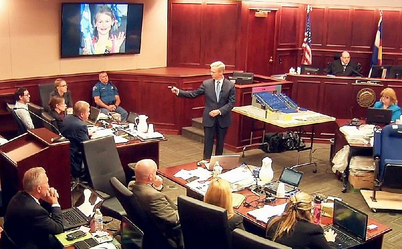In this video image, lead prosecutor George Brauchler gives closing arguments Thursday in Centennial, Colo., in the trial of James Holmes (background left).  