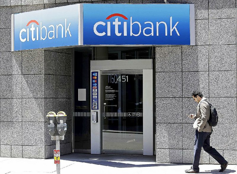 A man passes a Citibank branch in San Francisco in this file photo. Citigroup on Thursday reported a $4.57 billion second-quarter profit. 
