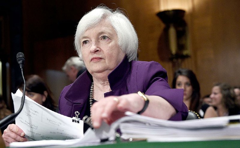 Federal Reserve Chairman Janet Yellen prepares to testify Thursday on Capitol Hill in Washington.