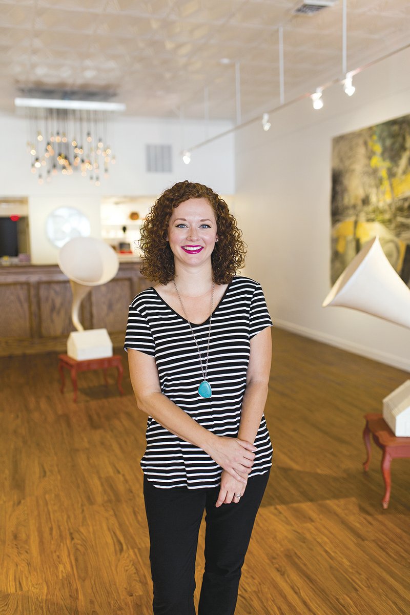 Carly Dahl, executive director of the Batesville Area Arts Council, poses for a photo in the council’s gallery. Dahl’s husband is a member of the art faculty at Lyon College, and she served as gallery director at the Lyon College Kresge Gallery for 4 1/2 years before accepting her new job.