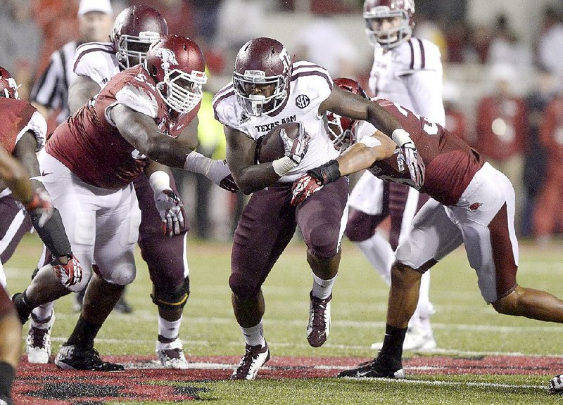 Texas A&M running back Tra Carson returns after leading the team with 581 yards rushing a year ago, but the Aggies hired former Wyoming Coach Dave Christensen as running game coordinator and offensive line coach to help improve a ground attack that ranked 12th in the SEC last season with 150 yards per game.