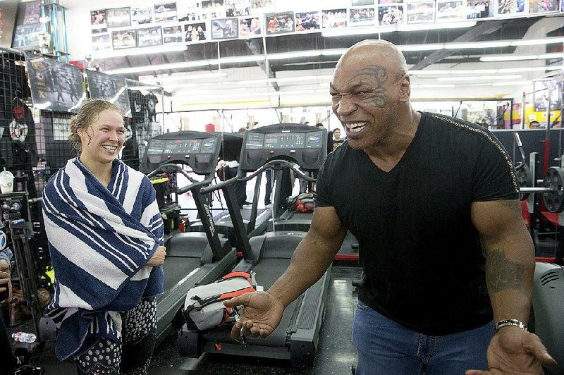 UFC women’s bantamweight champion Ronda Rousey (left) and former heavyweight boxing champion Mike Tyson have a lot of similar traits in the ring, Tyson told The Associated Press on Thursday.