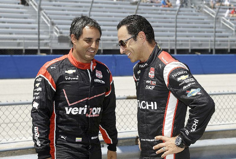 Team Penske drivers Juan Pablo Montoya (left) and Helio Castroneves hope they, along with teammate Will Power, can help break the team’s slump today at Iowa Speedway. Team Penske hasn’t won a race in eight years at the track.