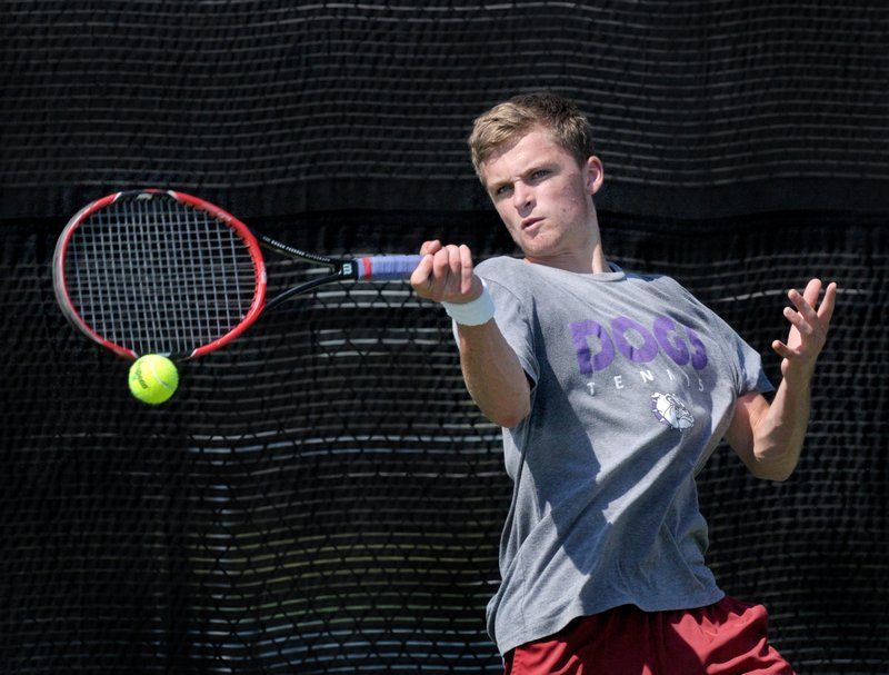 Will McCombs of Fayetteville competes Friday in his first-round match during the Mattel Summer Junior Open State Championships at Memorial Park in Bentonville.