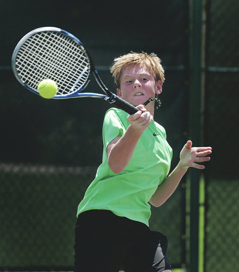 Jake Sweeney of Rogers competes in the boys 14s championship match on Sunday during the Mattel Summer Junior Open State Championships at Pinnacle Country Club in Rogers. Sweeney defeated Hayden Shoemake of Centerton 6-1, 6-2.