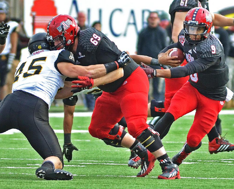 Arkansas State quarterback Fredi Knighten (right) was chosen as a first-team member of the preseason all-Sun Belt team on Monday in New Orleans. Eleven ASU players were picked for the first and second teams. 