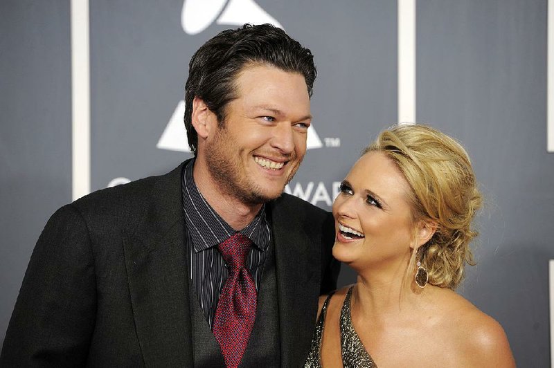 Blake Shelton (left) and Miranda Lambert are shown in this February 2011 file photo. Shelton and Lambert have announced their divorce after four years of marriage.