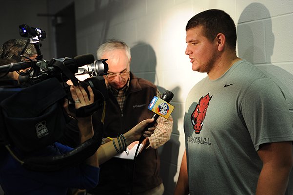 Lineman Zach Rogers speaks to members of the media Monday, Dec. 22, 2014, during a press conference ahead of the Razorbacks' Dec. 29 bowl game with Texas in Houston.