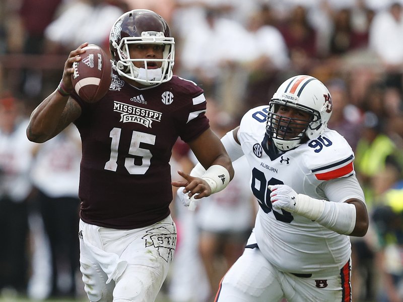 The return of all-conference quarterback Dak Prescott (15) and the experience of other returnees should be enough to overcome having only eight returning starters, Mississippi State Coach Dan Mullen said.