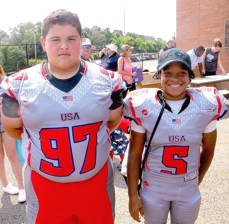 Courtesy photo Nykolaus Comer, of Farmington, with his buddy MJ from South Carolina after their game which they won on July 4 by a score of 25-13 over the Blue team during USA Football&#8217;s week-long training camp at Canton, Ohio.
