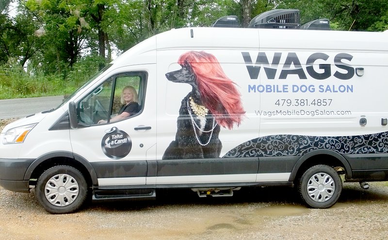 Lynn Atkins/The Weekly Vista Stacy Berger gave up her shop to go mobile this month. Her new mobile dog salon is called Wags.