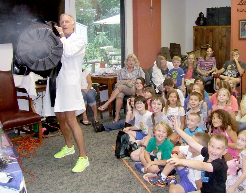 Tom A. Throne/The Weekly Vista Mad Scientist Steve Cox fires Vortex canon to show how air flows during a visit Thursday, July 9, to the Bella Vista Public Library as part of its Summer Reading program.