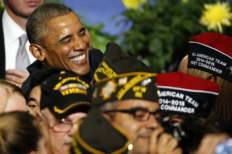 President Barack Obama greets the crowd Tuesday in Pittsburgh after speaking at the Veterans of Foreign Wars national convention. He called on lawmakers to better fund veterans’ health care services.