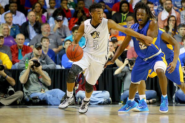 Bentonville's Malik Monk, (5) dribbles around North Little Rock's Kambrion Dickerson (12) during the Class 7A Boys State High School Basketball Championships in Hot Springs on Saturday, March 14, 2015.