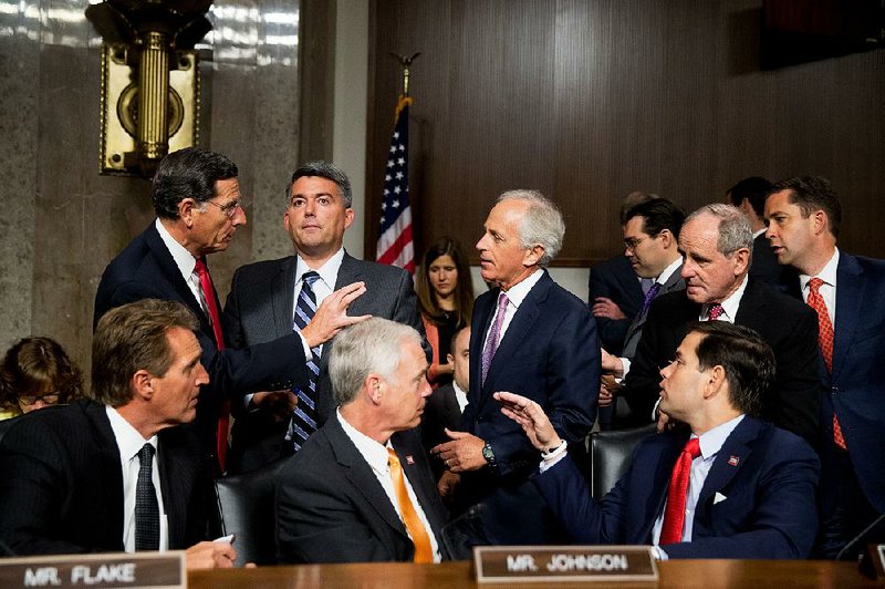 Republican Sens. John Barrasso of Wyoming (clockwise from top left), Cory Gardner of Colorado, Bob Corker of Tennessee, James Risch of Idaho, Jeff Flake of Arizona, Ron Johnson of Wisconsin and Marco Rubio of Florida speak Thursday before Secretary of State John Kerry arrives to testify in a Senate Foreign Relations Committee hearing in Washington.