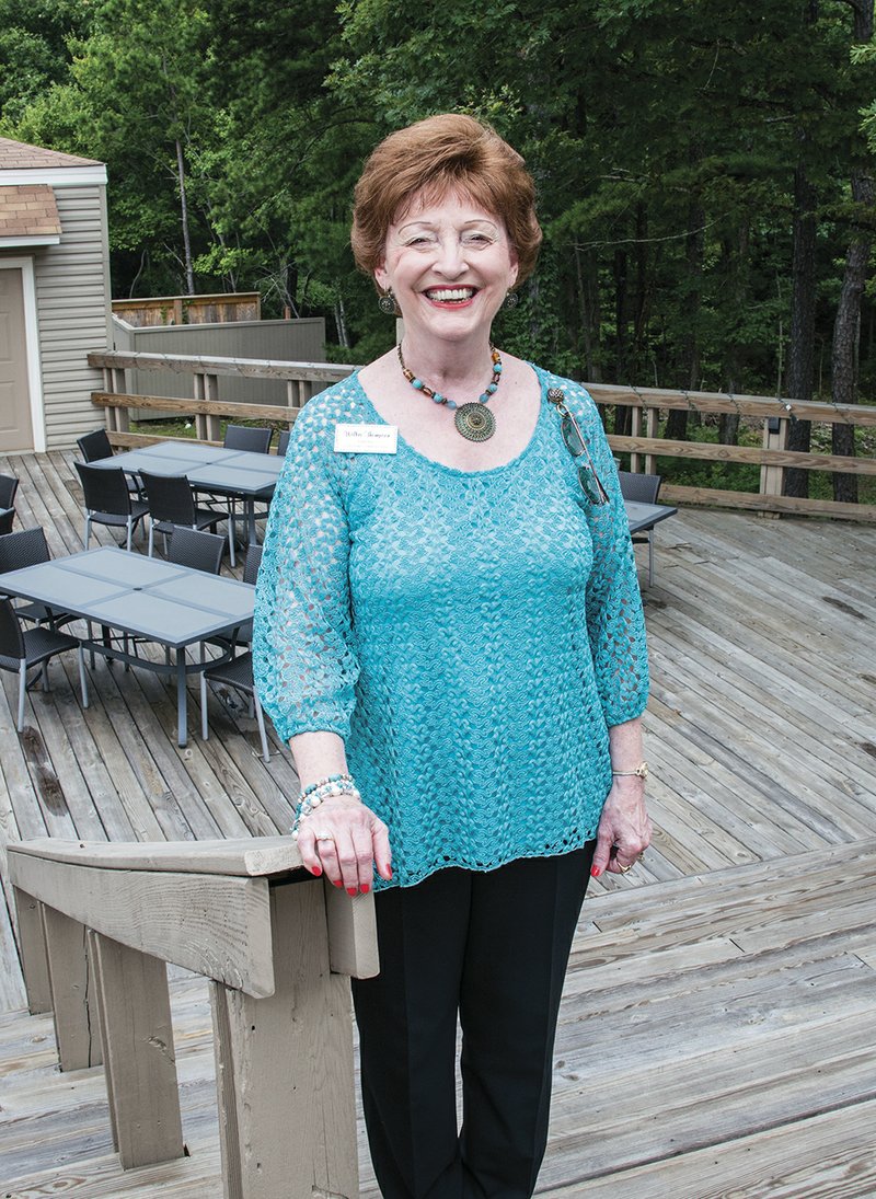 Wilba Thompson stands on the back deck of the Fairfield Bay Conference and Visitor Center, which was recently reopened after years of being shuttered. Thompson said reopening the center was a community effort, even down to the physical labor required to whip the building into shape.