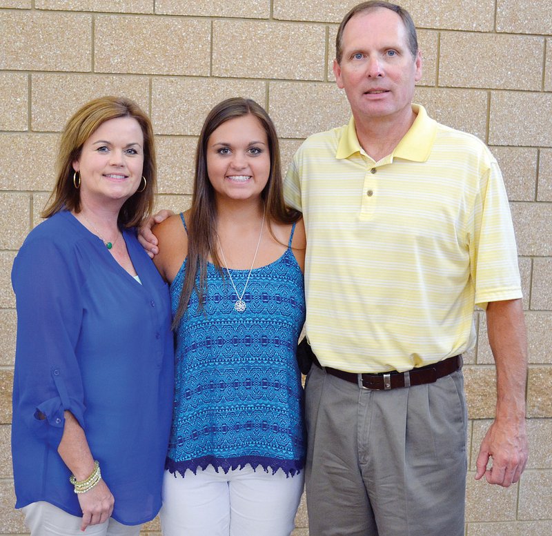 Alex Webb, center, poses for a photo with her mother and father, Stacey and Darrell Webb. Alex was diagnosed with leukemia when she was almost 3 years old. She has overcome the rigors of treatment to excel inside and outside the classrooms of the Atkins Public School District. This fall, she will embark on the next chapter of her life as a freshman at Arkansas Tech University in Russellville. Alex’s sister, Sydney, was not available for the photo.