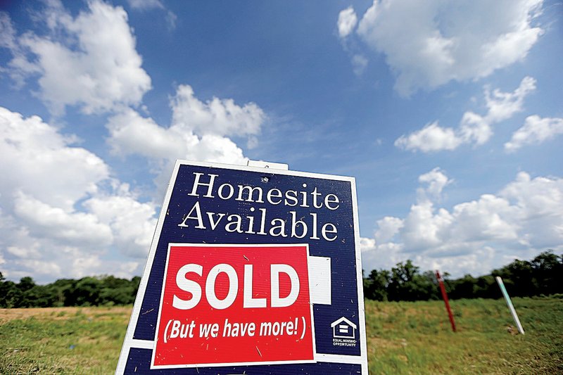 A sign marks a new home site that sold in a development in Nashville, Tenn., in June. New-home sales slumped 6.8 percent last month. 