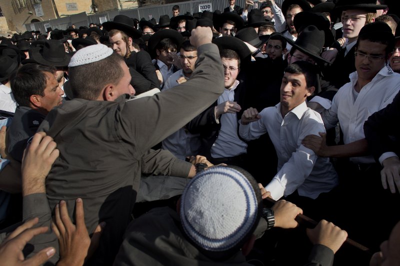 Ultra-orthodox Jewish men scuffle with Israeli security forces during a prayer organized by the Women of the Wall organization at the Western Wall in Jerusalem’s Old City.